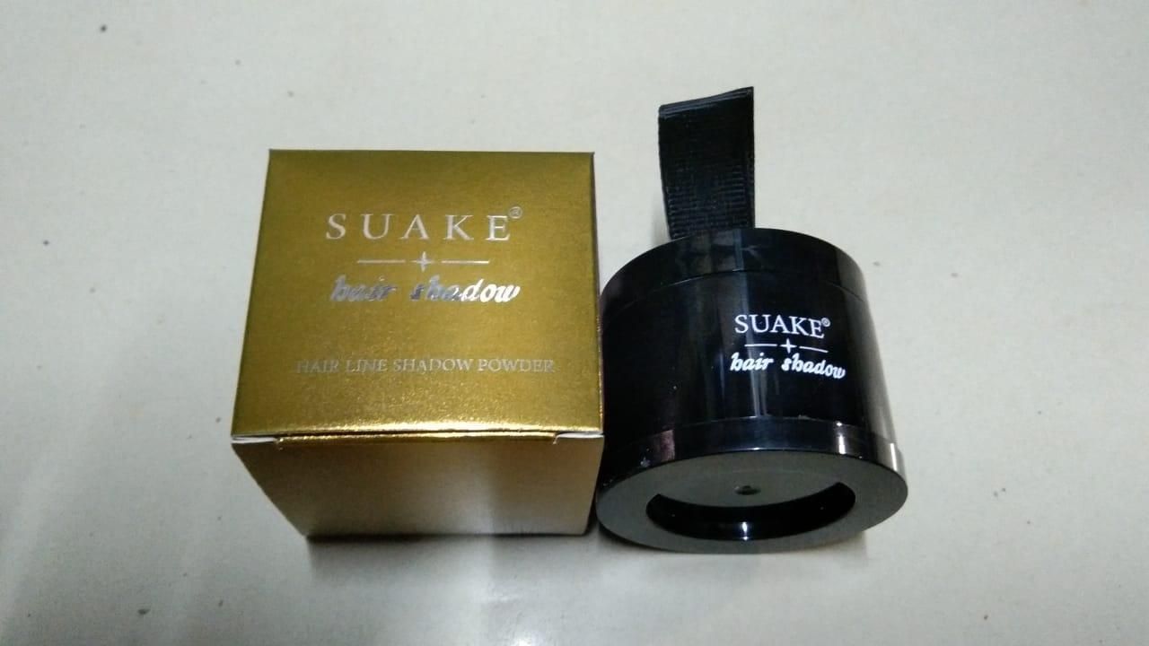 Portable hairline black powder in sleek black container with gold packaging for easy application