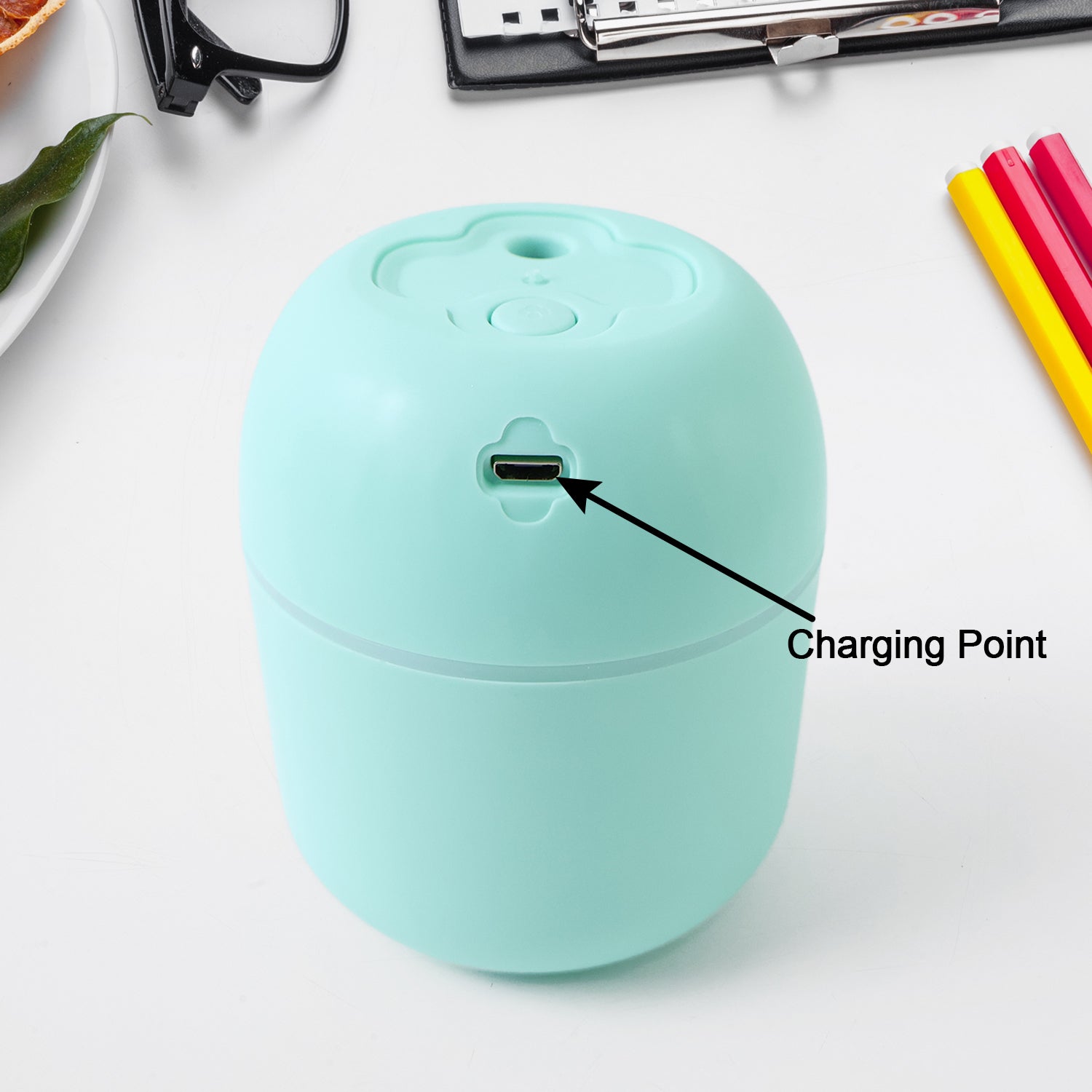 Portable mini USB humidifier in mint green with charging point for fresh office air