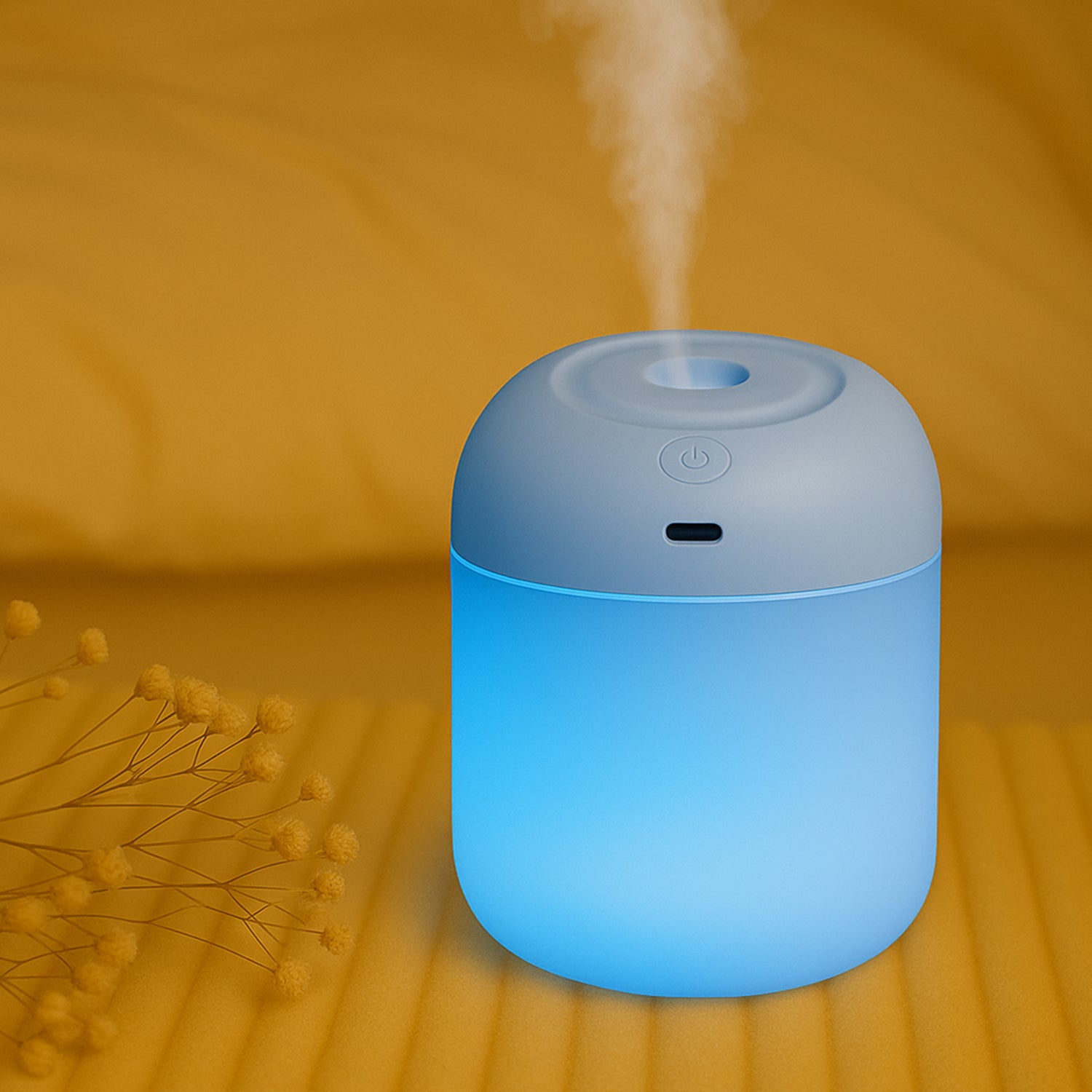 Portable mini USB humidifier with soothing blue lights for office use and improved air quality