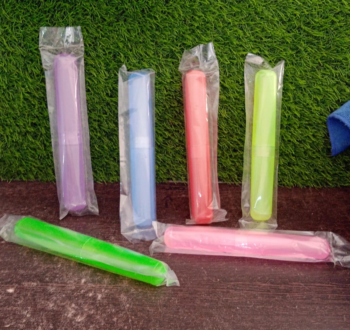 Colorful portable toothbrush case in various colors, perfect for travel and home use