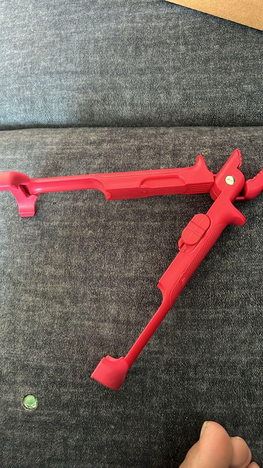 Red pot pan gripper tongs designed for a secure grip and safe handling of hot cookware