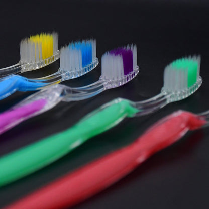 Set of four vibrant premium plastic toothbrushes in assorted colors for effective teeth cleaning