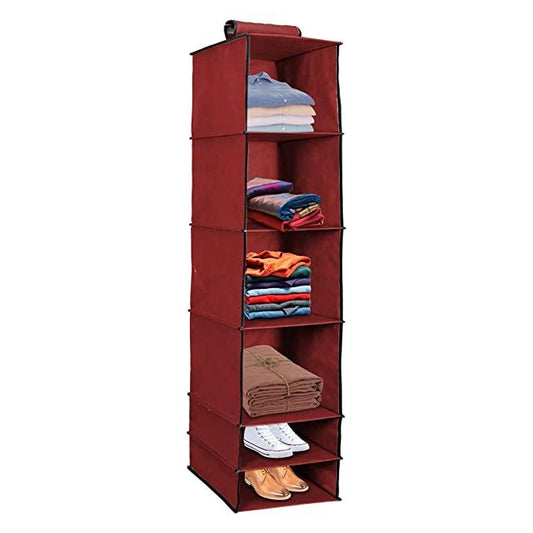 Maroon fabric wardrobe organizer with five shelves holding folded clothes and shoes