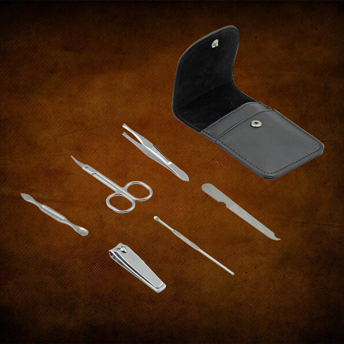 Professional nail care kit with stainless steel tools in a sleek black case for at-home grooming