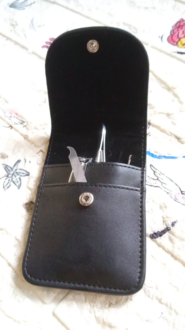 Your Brand professional nail care kit in a sleek black case with essential tools for nail grooming