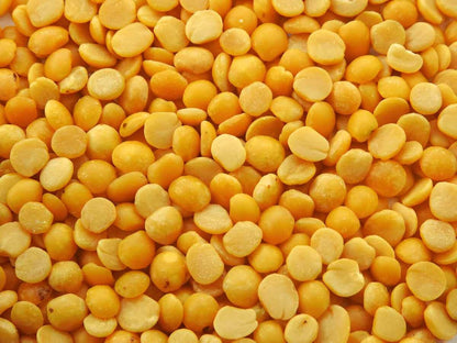 Close-up of yellow lentils, pure natural tur dal, ideal for healthy soups and curries