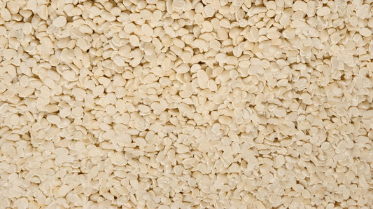 Close-up of pure urad dal for sale showing clean white split lentils from THE GIR FARMER