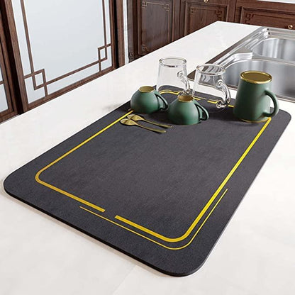 Stylish quick drying kitchen mat on counter with glassware and utensils for easy drying