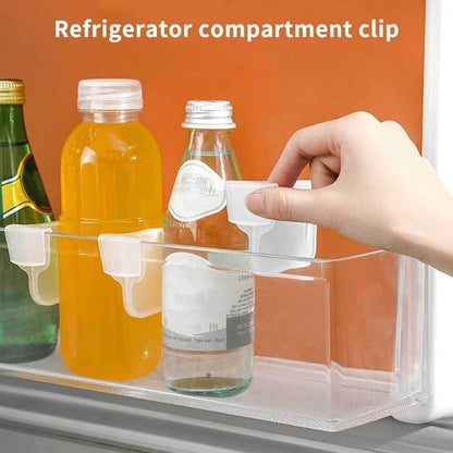 Clear refrigerator organizer bins holding drinks with easy access for efficient space management