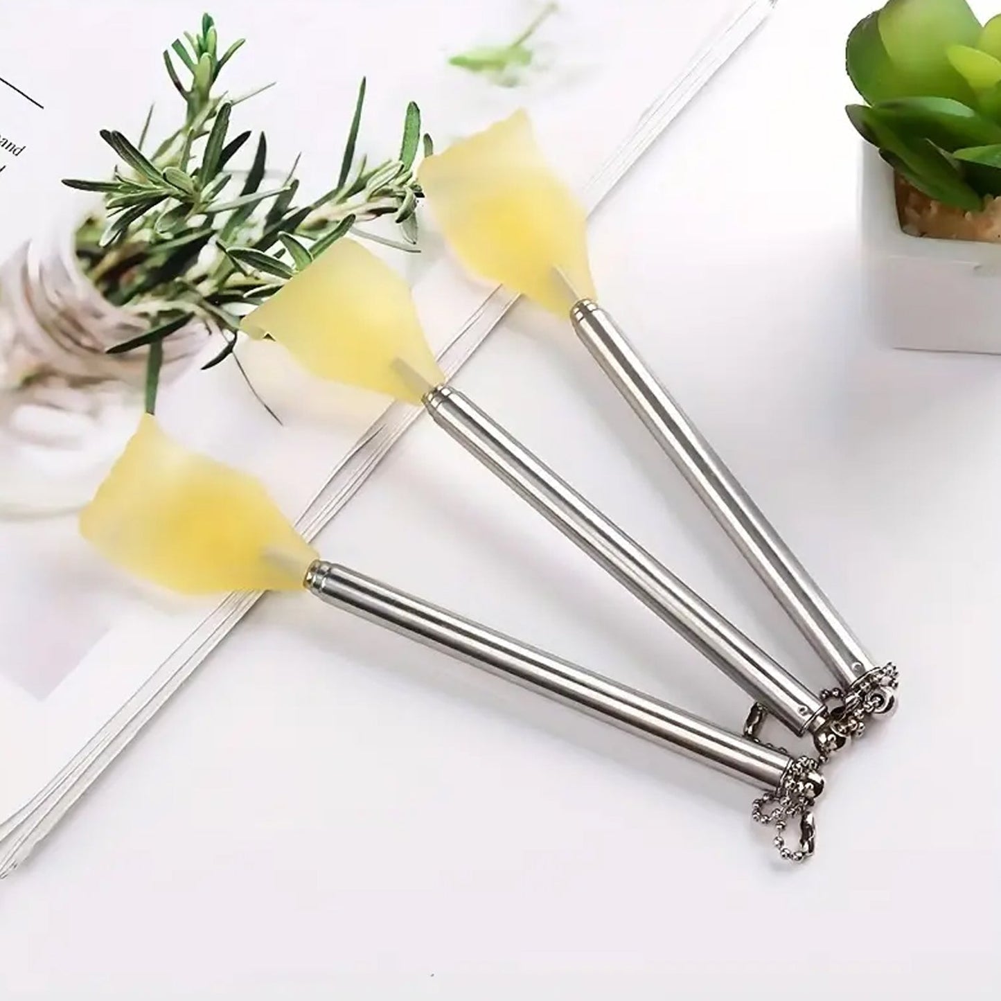 Set of three retractable metal back scratchers with comfortable grip and stylish design