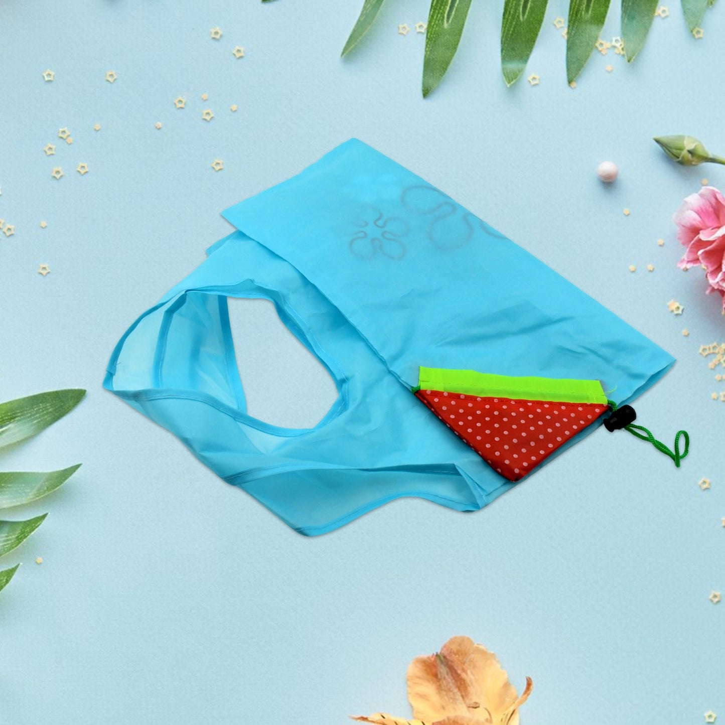 Light blue reusable grocery bag with handles, folded compactly with colorful lining