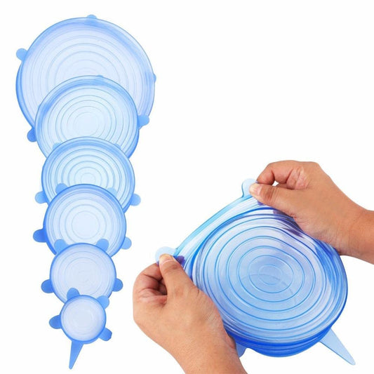 THE GIR FARMER reusable lids for bowls and containers in multiple sizes held by hands stretching blue silicone lids