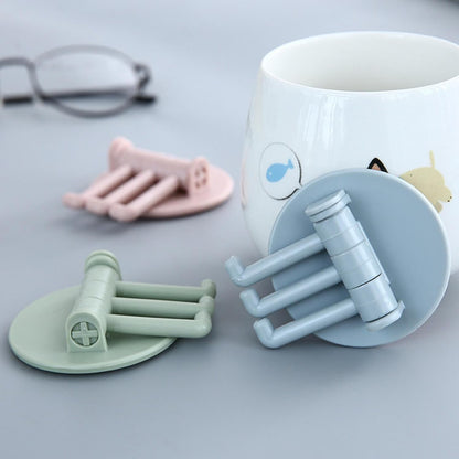 Rotating sticky wall hook in pastel colors designed for versatile home organization and space-saving