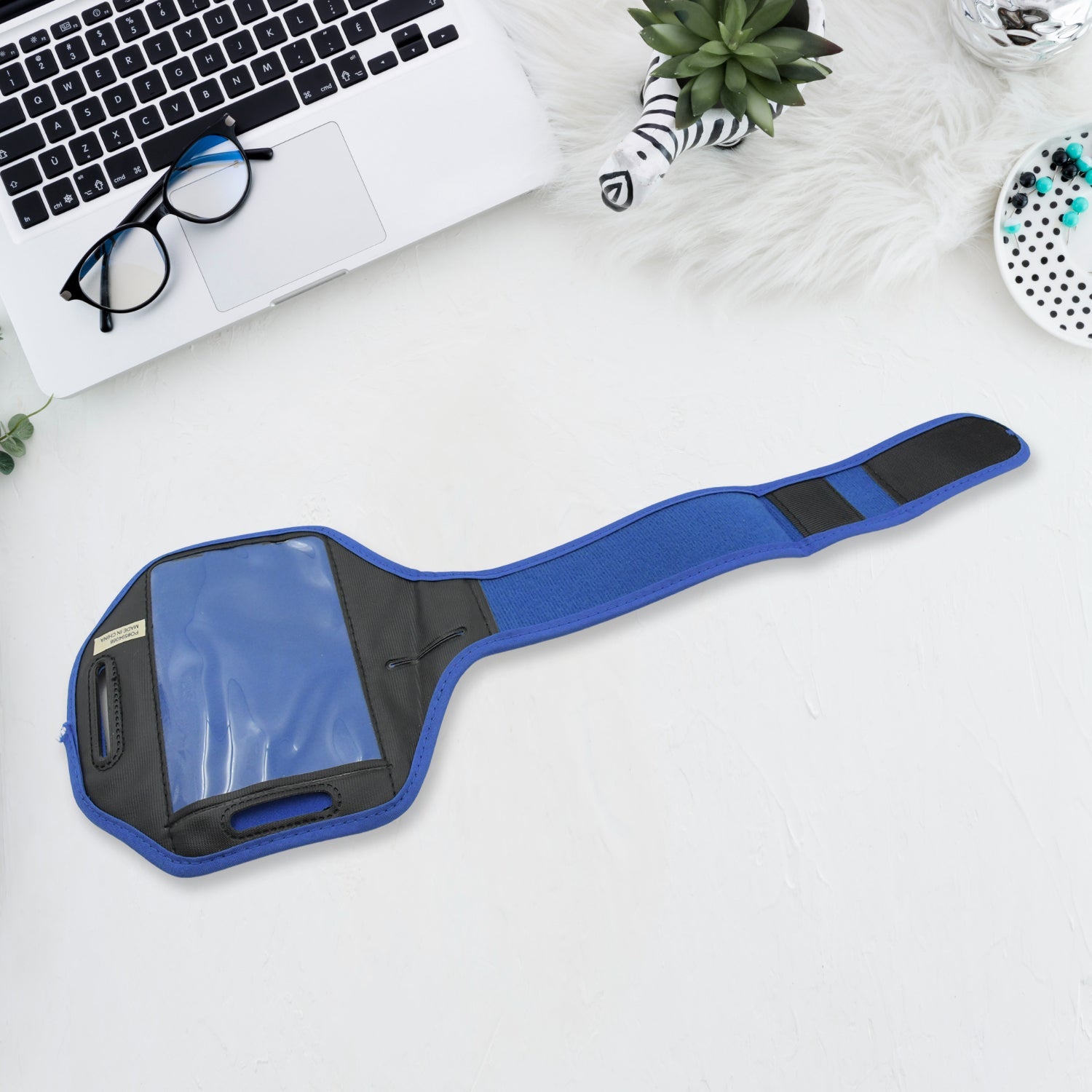 Blue running armband phone holder designed for secure and convenient phone access during workouts