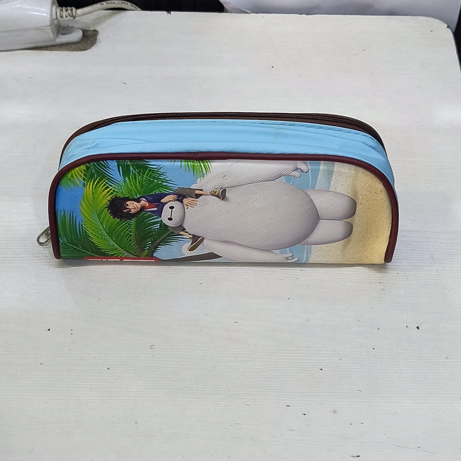 Amd-Deodap school pencil case for children featuring playful cartoon characters and a blue zipper