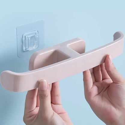 Installation of a self adhesive bathroom towel rack in a soft pink color for convenience and easy access