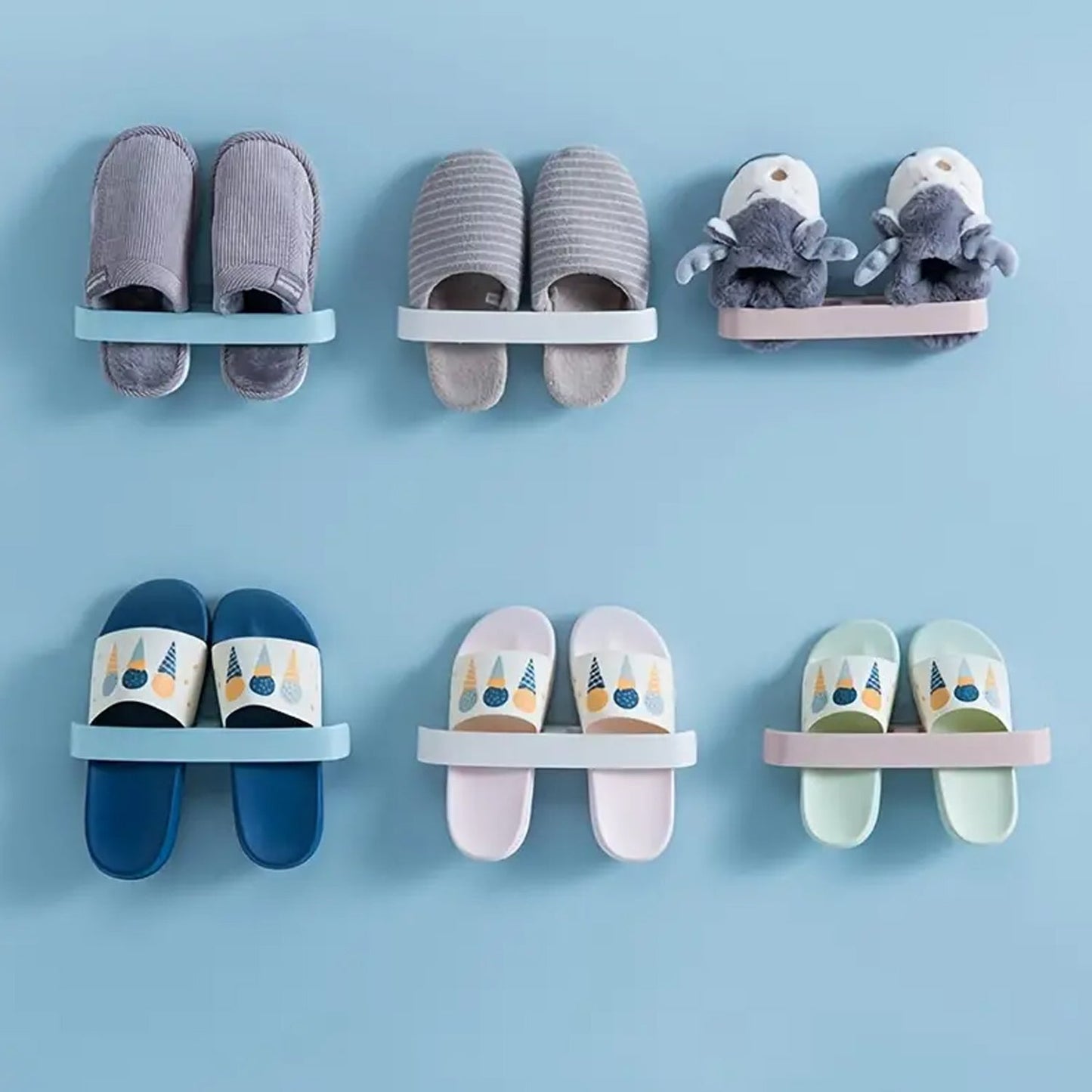 Decorative self adhesive bathroom towel rack holding stylish slippers and plush toys on a blue wall