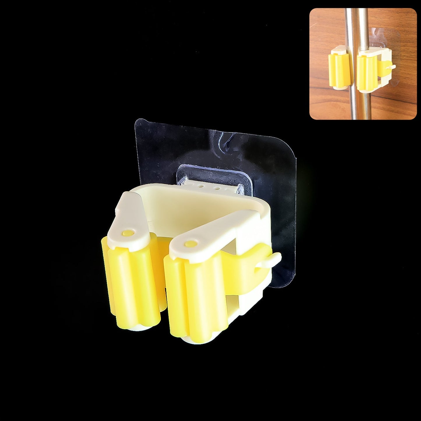 Self adhesive mop holder in yellow for convenient storage of mops and cleaning tools