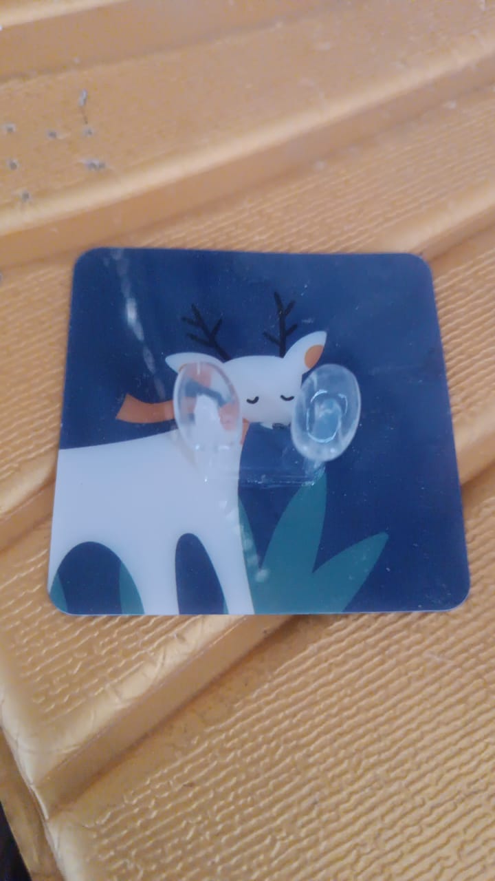 Self-adhesive wall hook featuring a cute deer design for easy home organization