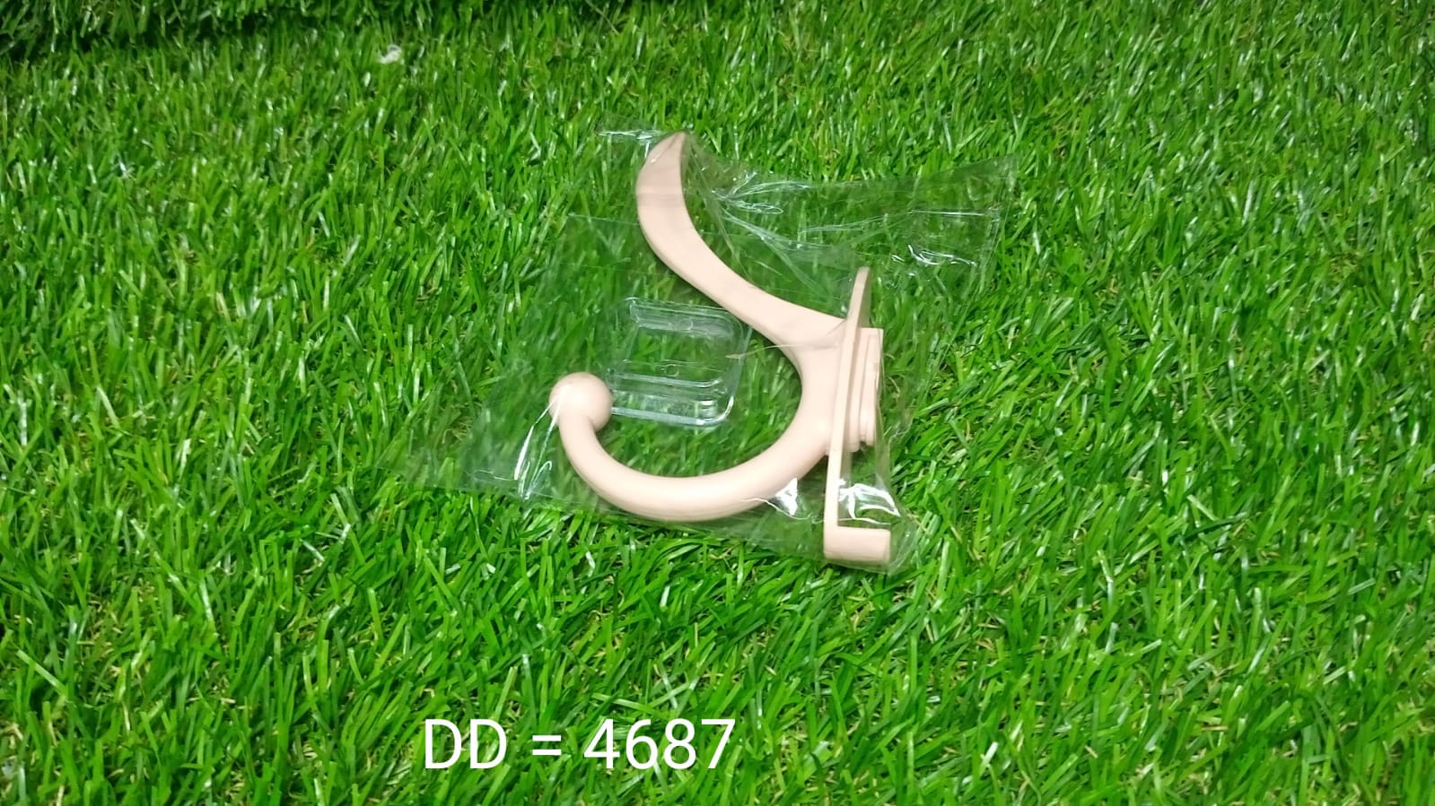Self adhesive wall hooks in beige color for hanging items securely and easily