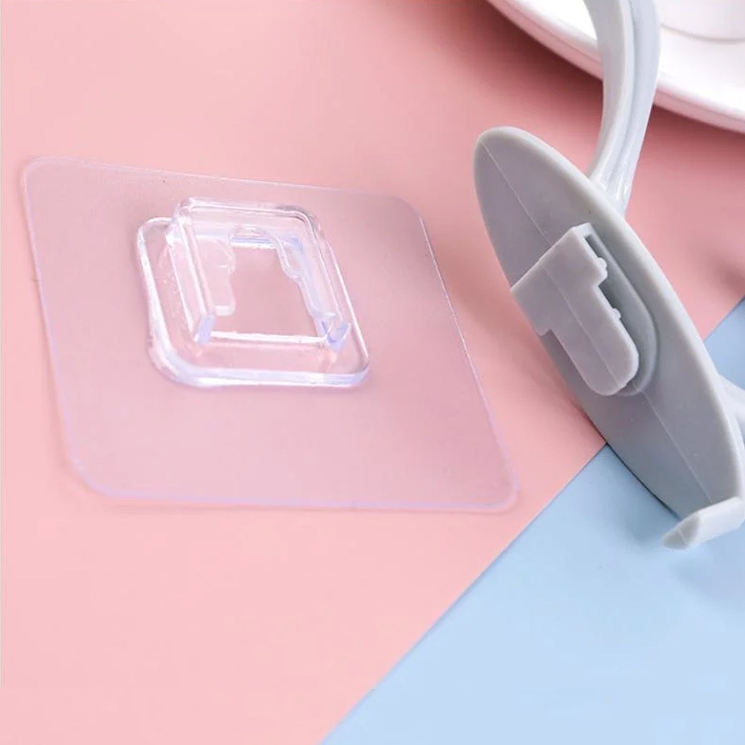Self adhesive wall hooks in clear design for easy mounting on various surfaces