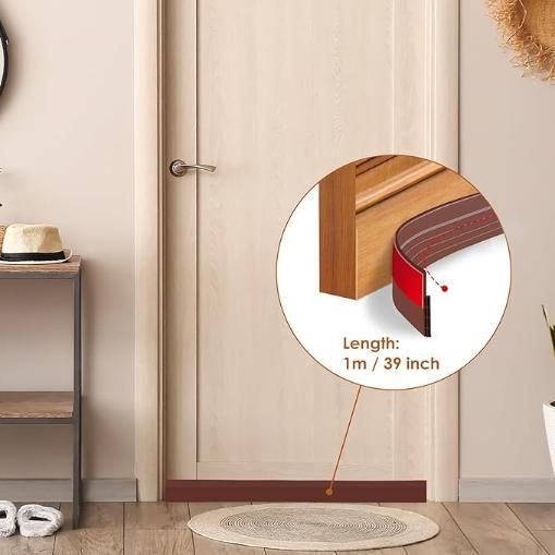 THE GIR FARMER self-adhesive wood floor transition strip installed at the base of a light wood door