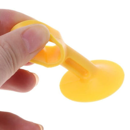 Bright yellow self-sucking silicone door stopper designed for effective door security and stability