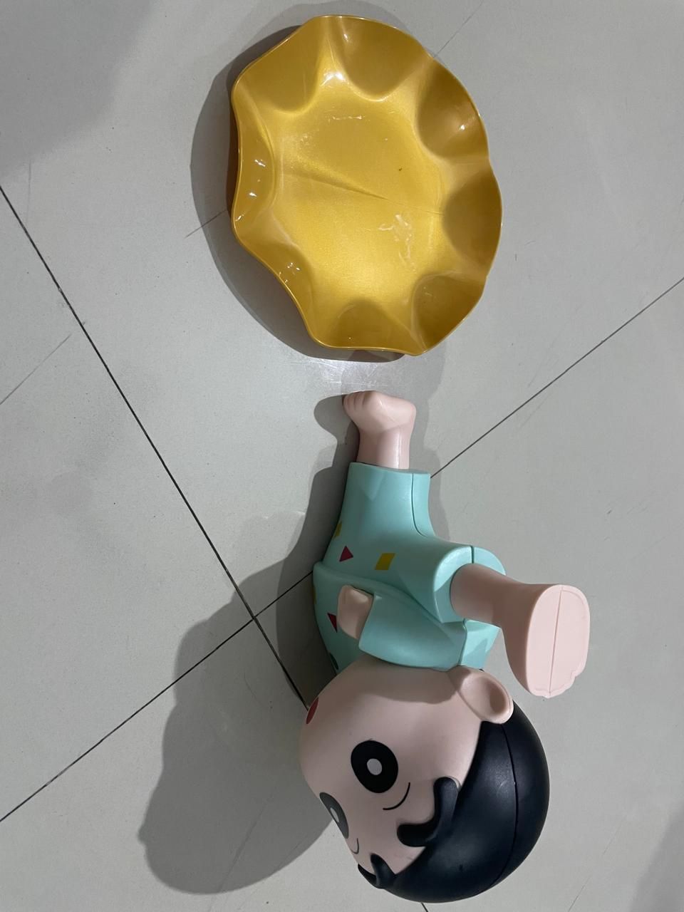 Shinchan tray holder featuring a playful character design with a yellow tray for snacks or small items