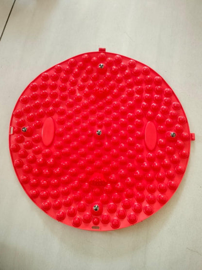 Red silicone foot massage pad with raised nodes for stimulating pressure points and improving circulation