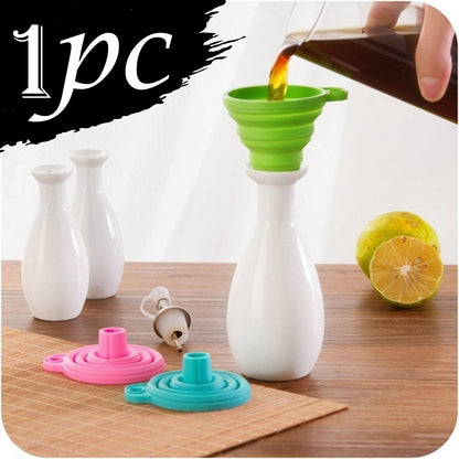 Silicone kitchen funnel in green and pink for easy pouring and transferring liquids in the kitchen