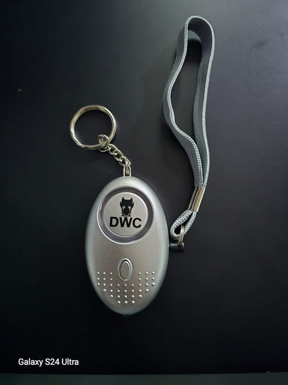 Silver emergency safety keyring with wrist strap and DWC logo on black background