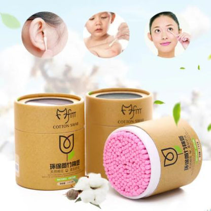 Soft wood stick cotton swabs in eco-friendly brown packaging with pink tips for gentle use