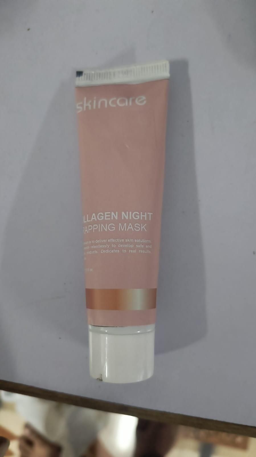 Collagen night peel off mask in a pink tube for rejuvenating and hydrating skin overnight