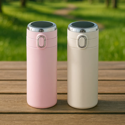 Wukusy smart insulated water bottle in pink and cream colors for maintaining drink temperature outdoors