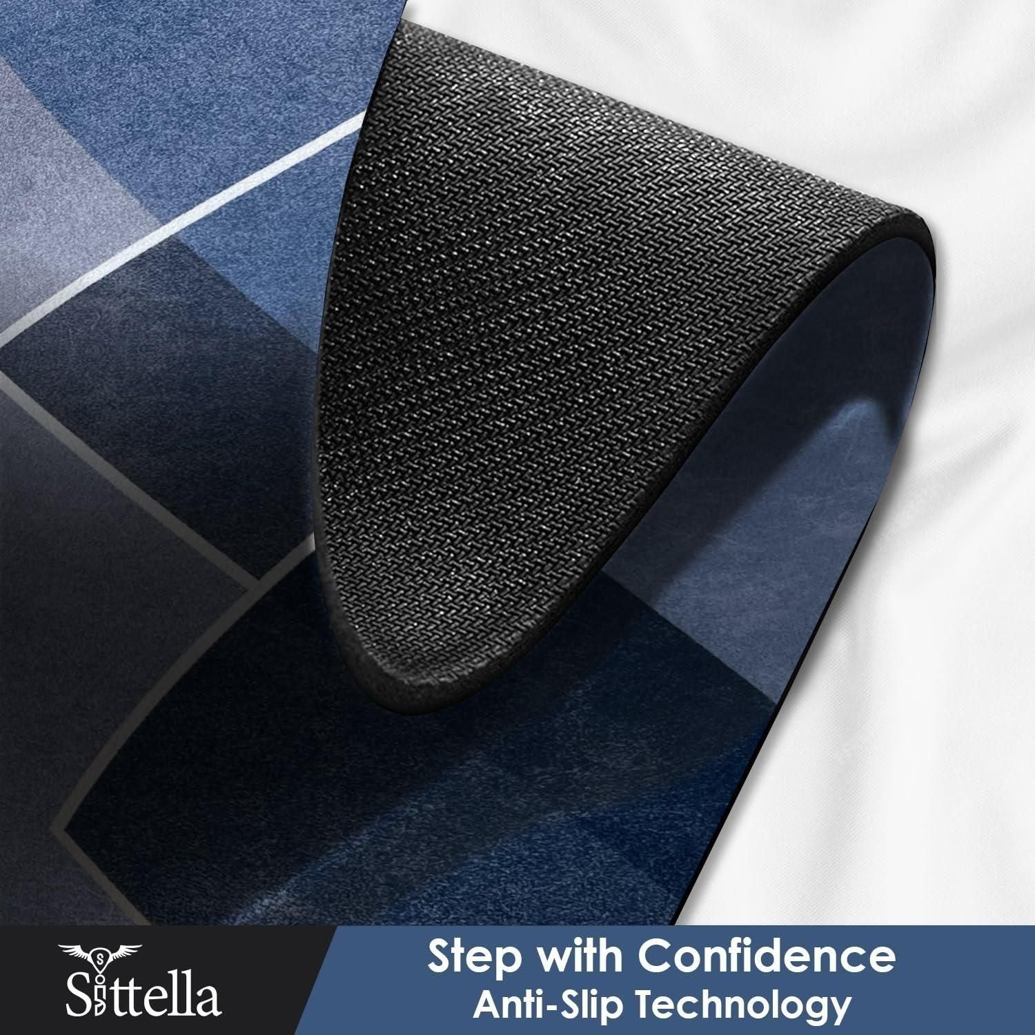 Rubber floor mat with geometric pattern in shades of blue and black featuring anti-slip backing