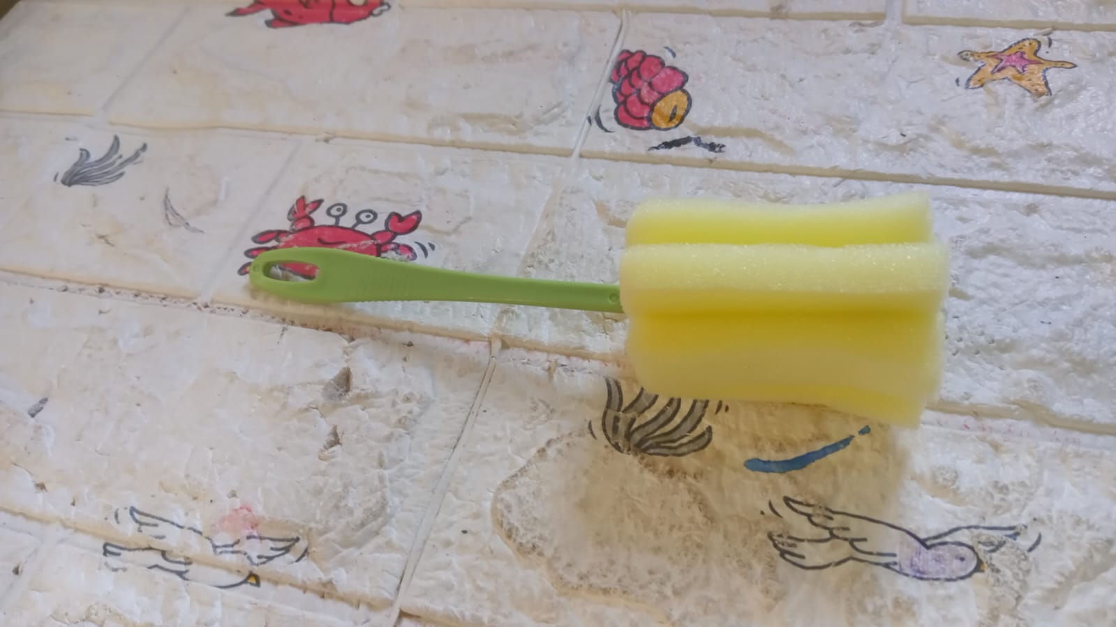 Yellow sponge head kitchen cleaning tool for effective dish and surface cleaning