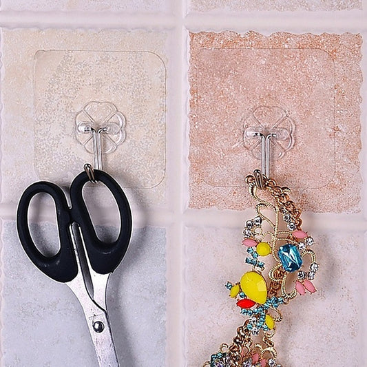 Stainless steel adhesive wall hooks holding scissors and jewelry for easy organization