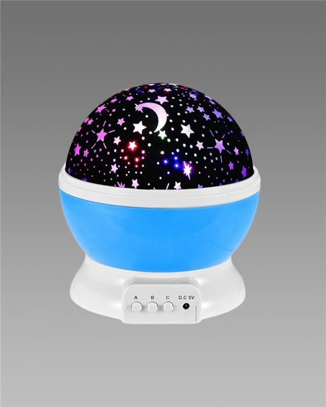 Star master galaxy projection lamp with blue base and star and moon patterns projecting colorful lights