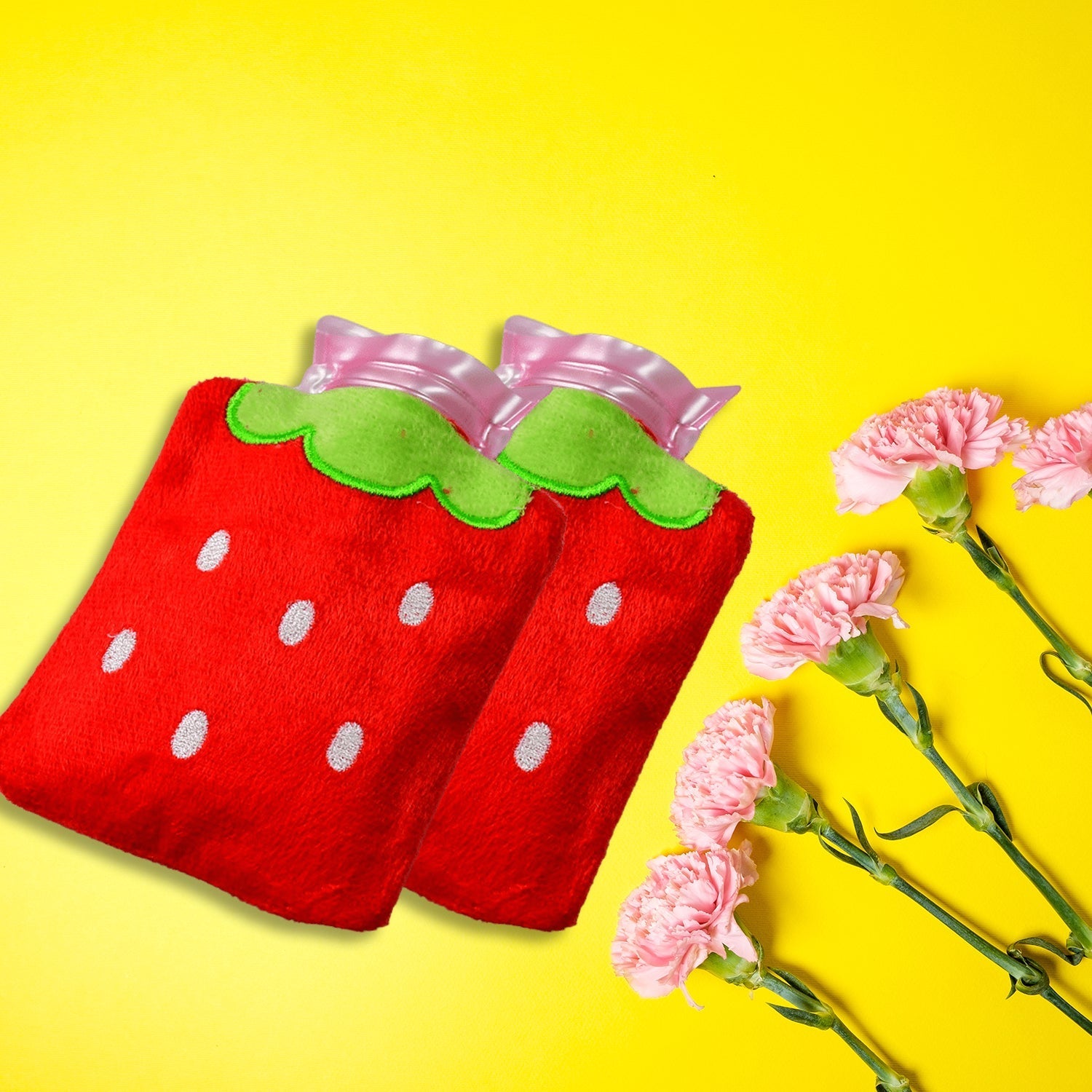 Strawberry mini hot water bag in red with green accents for soothing warmth and comfort