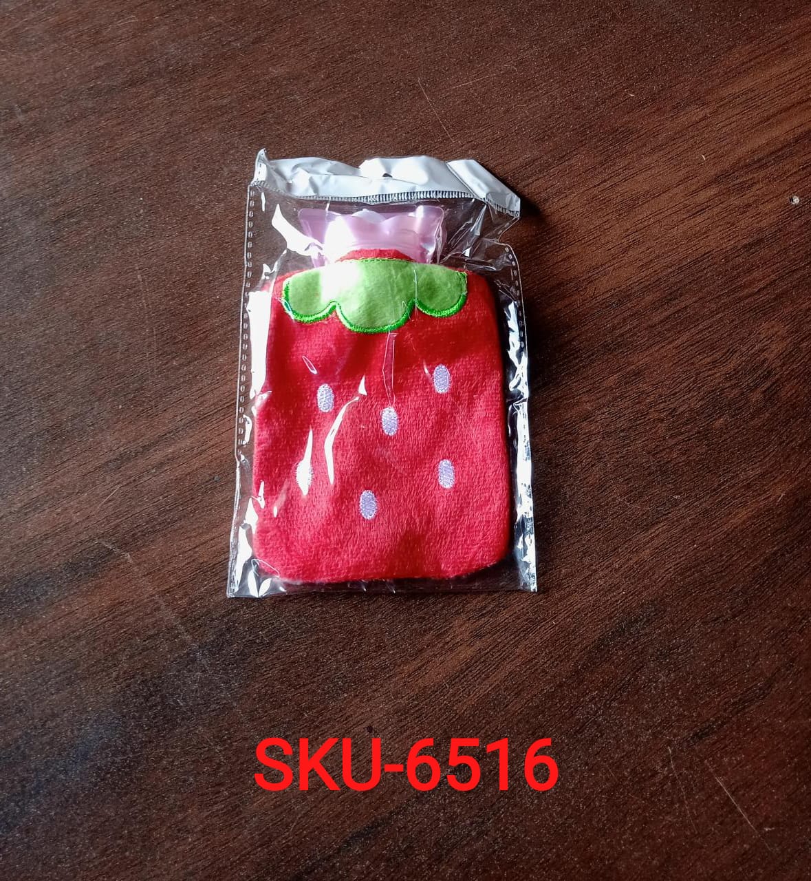 Strawberry mini hot water bag in a cute design, perfect for warmth and comfort on cold days