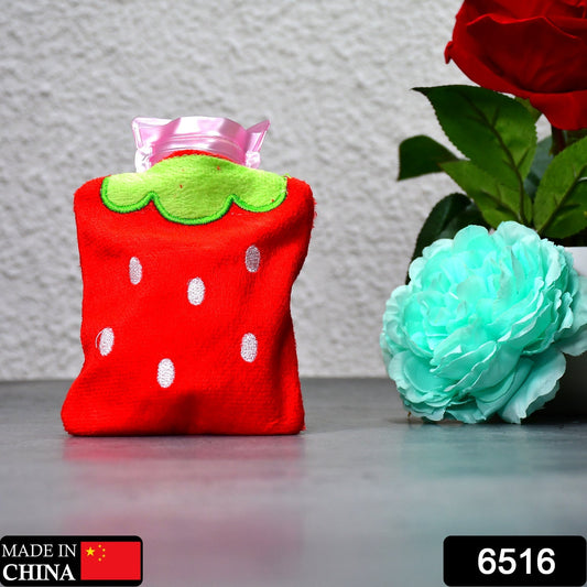 Strawberry mini hot water bag in red plush material for soothing warmth and comfort