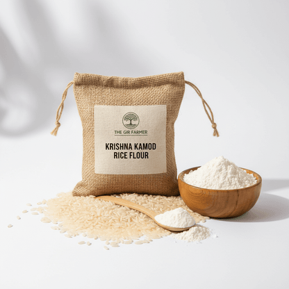 Krishna Kamod Rice Flour by The Gir Farmer in a burlap bag with loose rice and flour on a white background