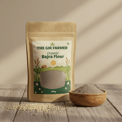THE GIR FARMER Organic Bajra Flour in a resealable pouch with a wooden bowl of flour