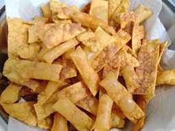 Crispy golden fried snacks made from Organic Chorafali Flour, perfect for a savory treat