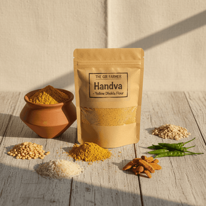 THE GIR FARMER Organic Handva & Yellow Dhokla Flour in a pouch with spices and ingredients surrounding it