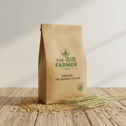 The Gir Farmer Organic Jau Flour in a brown eco-friendly bag with barley grains nearby