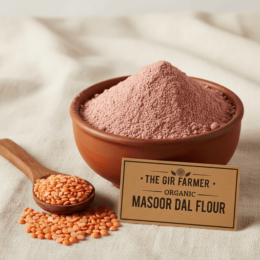 Organic Masoor Dal Flour in a clay bowl with red lentils beside it, ideal for healthy cooking