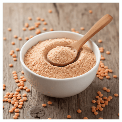 Bowl of red lentils flour with wooden spoon, perfect for soups and baking recipes