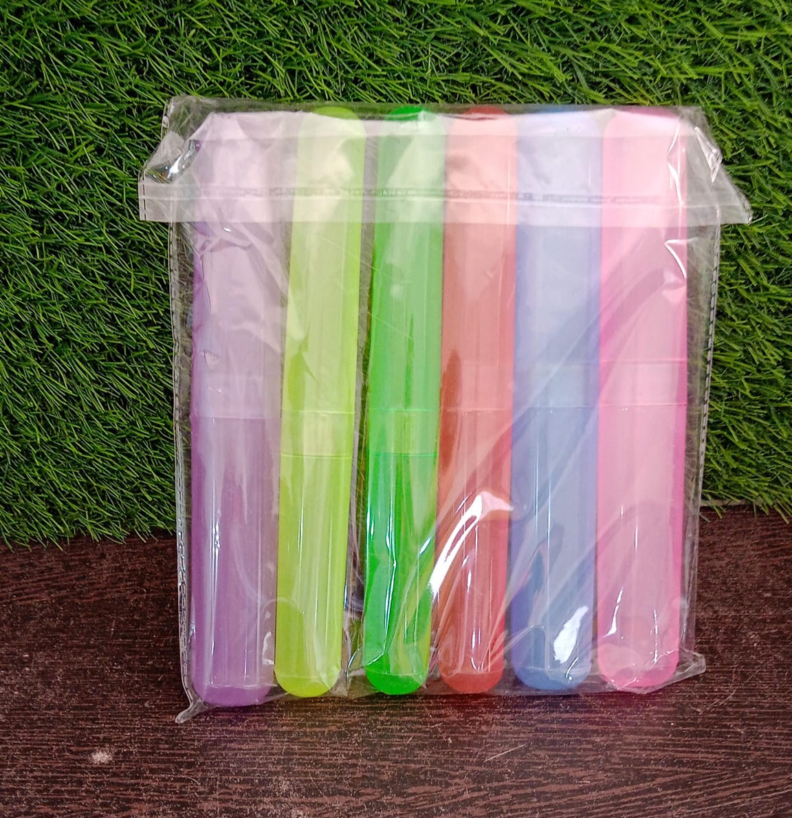 Colorful toothbrush travel covers in a clear pouch for convenient travel hygiene
