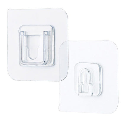 Transparent adhesive hook for wall, perfect for hanging items without damage to surfaces.